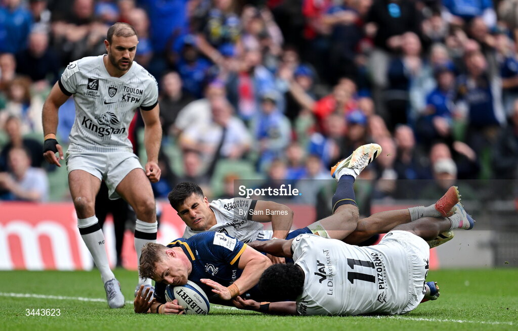 2 May 2026; Garry Ringrose of Leinster dives over to score his side's third try despite the efforts of Tomas Albornoz, top, and Setariki Tuicuvu of RC Toulon during the Investec Champions Cup semi-final match between Leinster and RC Toulon at the Aviva Stadium in Dublin. Photo by Sam Barnes/Sportsfile