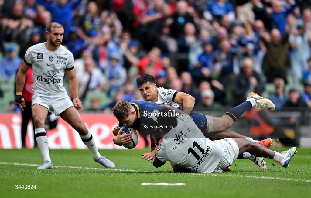 2 May 2026; Garry Ringrose of Leinster dives over to score his side's third try despite the efforts of Tomas Albornoz, top, and Setariki Tuicuvu of RC Toulon during the Investec Champions Cup semi-final match between Leinster and RC Toulon at the Aviva Stadium in Dublin. Photo by Sam Barnes/Sportsfile