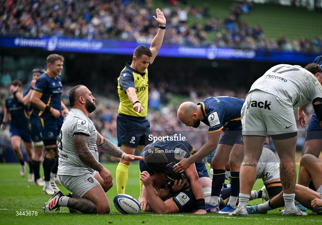 2 May 2026; Caelan Doris of Leinster, bottom, celebrates with teammates Alex Soroka, left, and Jamison Gibson-Park after scoring their side's fourth try during the Investec Champions Cup semi-final match between Leinster and RC Toulon at the Aviva Stadium in Dublin. Photo by Sam Barnes/Sportsfile