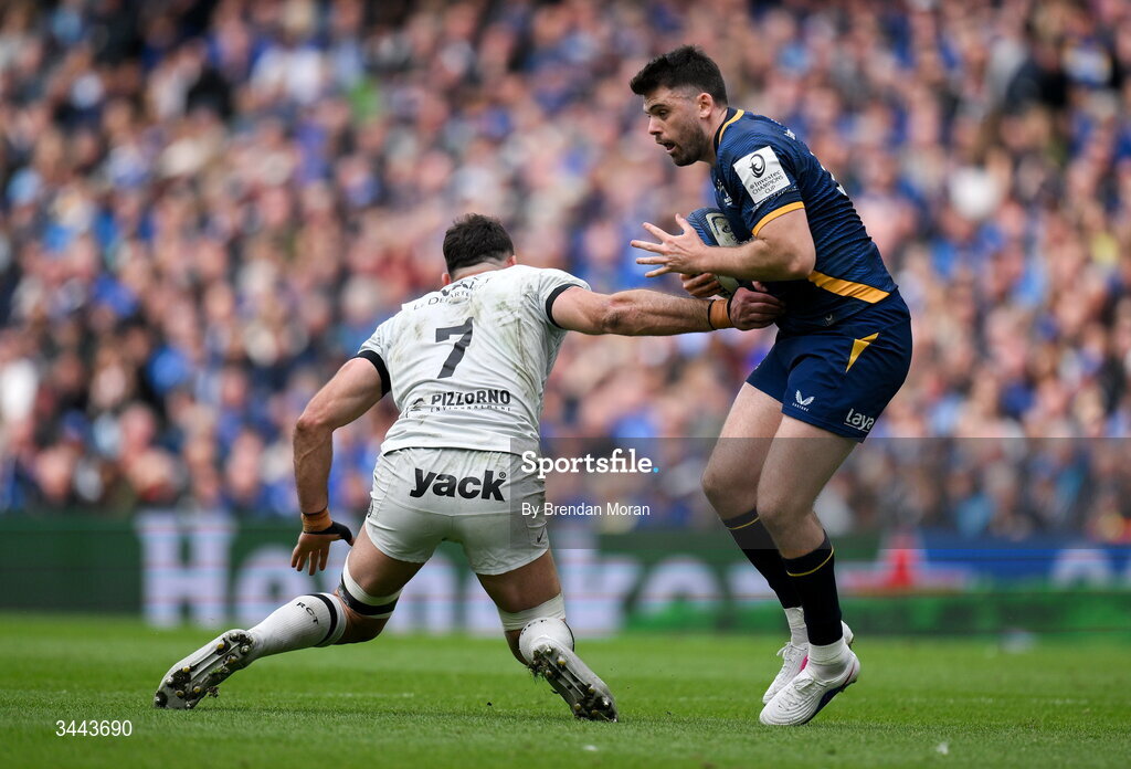 2 May 2026; Harry Byrne of Leinster evades the tackle of Charles Ollivon of RC Toulon during the Investec Champions Cup semi-final match between Leinster and RC Toulon at the Aviva Stadium in Dublin. Photo by Brendan Moran/Sportsfile
