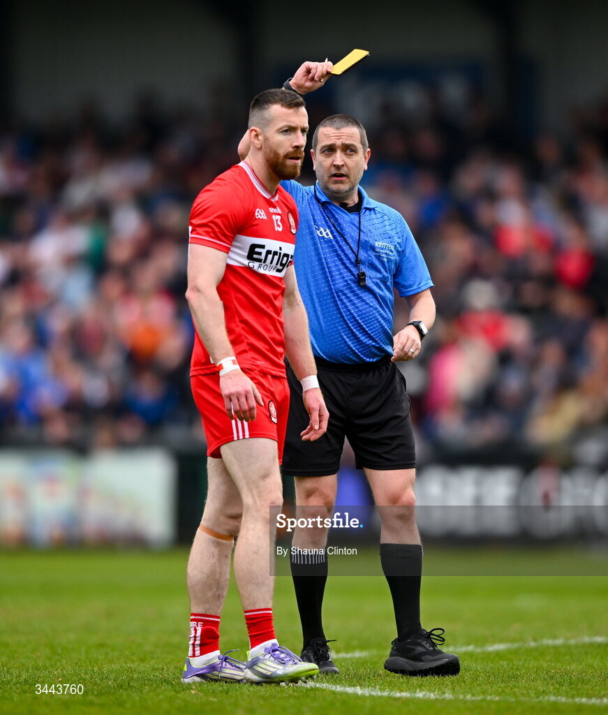 2 May 2026; Referee Noel Mooney shows Niall Loughlin of Derry a yellow card during the Ulster GAA Football Senior Championship semi-final match between Derry and Monaghan at BOX-IT Athletic Grounds in Armagh. Photo by Shauna Clinton/Sportsfile