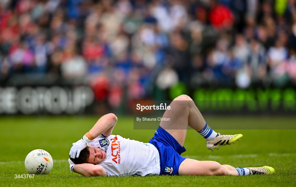 2 May 2026; Dylan Byrne of Monaghan goes down injured after being fouled by Niall Loughlin of Derry, not pictured, during the Ulster GAA Football Senior Championship semi-final match between Derry and Monaghan at BOX-IT Athletic Grounds in Armagh. Photo by Shauna Clinton/Sportsfile