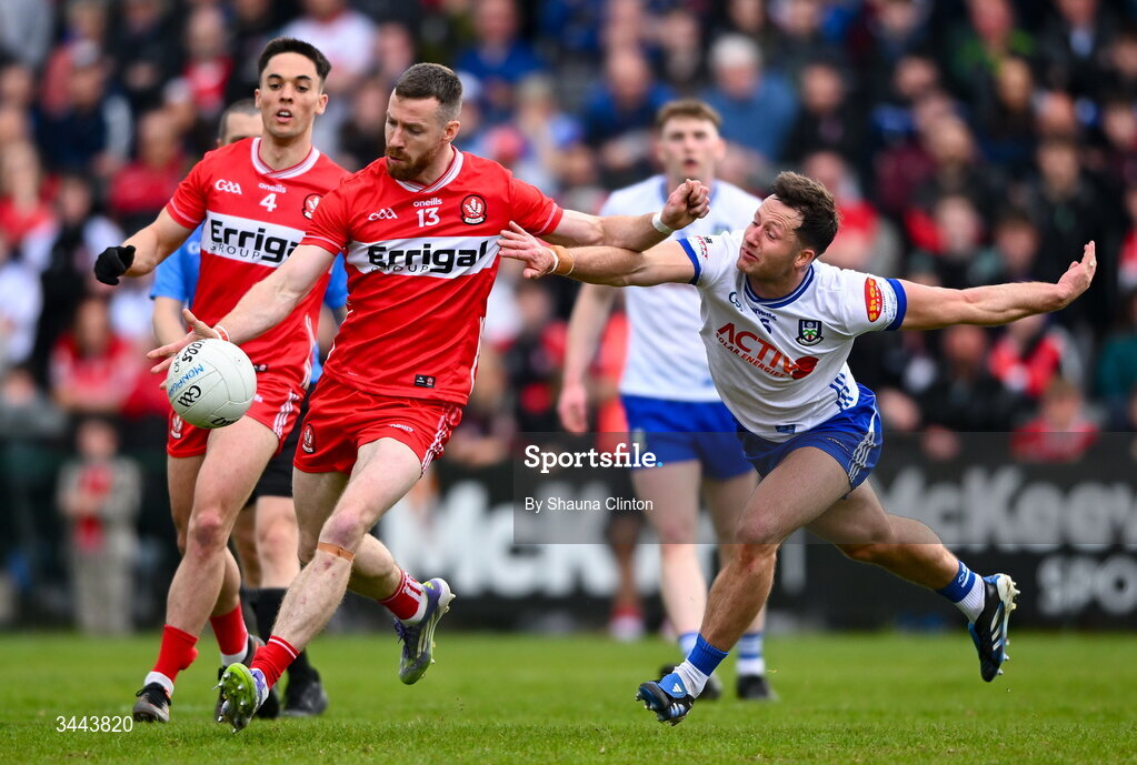 2 May 2026; Niall Loughlin of Derry kicks a point despite the efforts of Dessie Ward of Monaghan during the Ulster GAA Football Senior Championship semi-final match between Derry and Monaghan at BOX-IT Athletic Grounds in Armagh. Photo by Shauna Clinton/Sportsfile