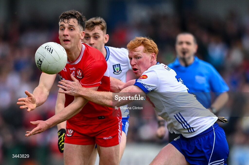 2 May 2026; Shane McGuigan of Derry is tackled by Ryan O'Toole of Monaghan during the Ulster GAA Football Senior Championship semi-final match between Derry and Monaghan at BOX-IT Athletic Grounds in Armagh. Photo by Shauna Clinton/Sportsfile