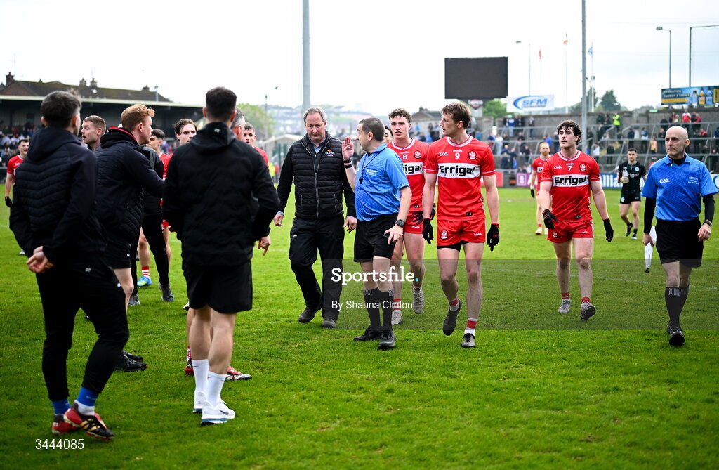 2 May 2026; Derry players speak with referee Noel Mooney as they leave the pitch ahead of extra-time during the Ulster GAA Football Senior Championship semi-final match between Derry and Monaghan at BOX-IT Athletic Grounds in Armagh. Photo by Shauna Clinton/Sportsfile