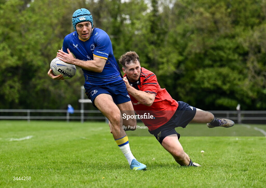 2 May 2026; Oisin McKenna of Leinster escapes the tackle of Jack O'Connell of Munster before scoring a try during the IRFU Men's Junior Interprovincials Round 2 match between Munster and Leinster at DLSP FC in Kiltiernan, Dublin. Photo by Paul Phelan/Sportsfile