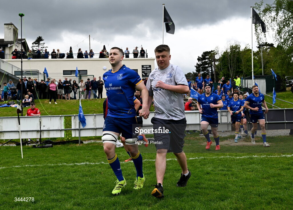2 May 2026; Leinster captain Donal McMahon and mascot Luke Cahill run out onto the pitch before the IRFU Men's Junior Interprovincials Round 2 match between Munster and Leinster at DLSP FC in Kiltiernan, Dublin. Photo by Paul Phelan/Sportsfile