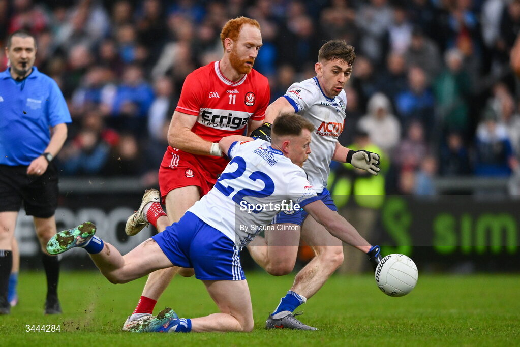 2 May 2026; Conor Glass of Derry in action against Monaghan players Ryan Duffy, left, and Micheal Bannigan during the Ulster GAA Football Senior Championship semi-final match between Derry and Monaghan at BOX-IT Athletic Grounds in Armagh. Photo by Shauna Clinton/Sportsfile