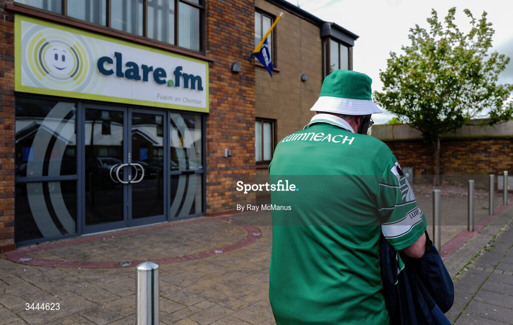 3 May 2026;  An early arriving Limerick supporter passes the premises of Clare FM on his way to the Munster GAA Senior Hurling Championship Round 3 match between Clare and Limerick at Zimmer Biomet Páirc Chíosóg in Ennis, Clare. Photo by Ray McManus/Sportsfile