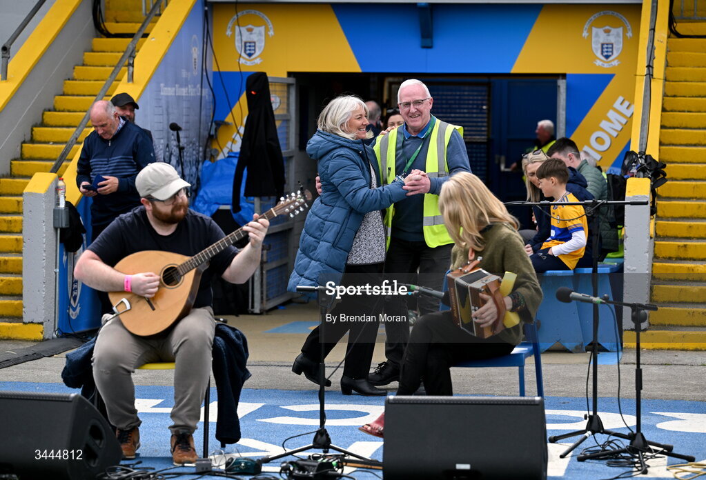 3 May 2026; Cusack Park maor Martin Keane and national anthem singer Denise Whelan dance a set while listening to musicians Killian and Sharon Shannon as they entertain the crowd before the Munster GAA Senior Hurling Championship Round 3 match between Clare and Limerick at Zimmer Biomet Páirc Chíosóg in Ennis, Clare. Photo by Brendan Moran/Sportsfile
