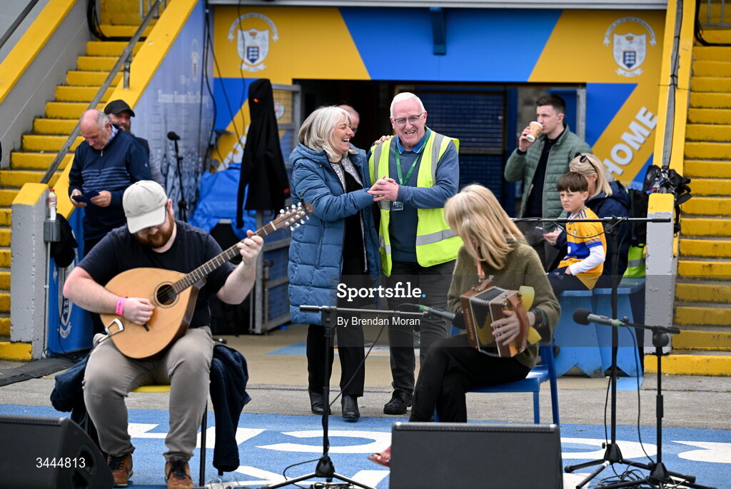 3 May 2026; Cusack Park maor Martin Keane and national anthem singer Denise Whelan dance a set while listening to musicians Killian and Sharon Shannon as they entertain the crowd before the Munster GAA Senior Hurling Championship Round 3 match between Clare and Limerick at Zimmer Biomet Páirc Chíosóg in Ennis, Clare. Photo by Brendan Moran/Sportsfile