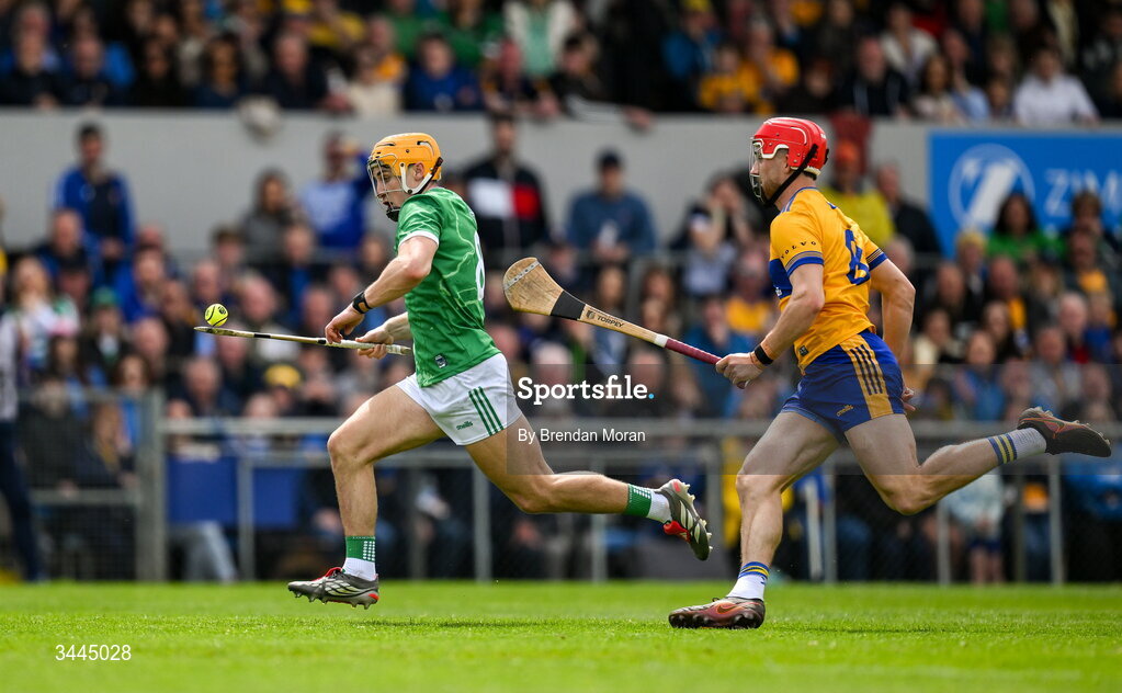 3 May 2026; Adam English of Limerick races clear of Darragh Lohan of Clare during the Munster GAA Senior Hurling Championship Round 3 match between Clare and Limerick at Zimmer Biomet Páirc Chíosóg in Ennis, Clare. Photo by Brendan Moran/Sportsfile