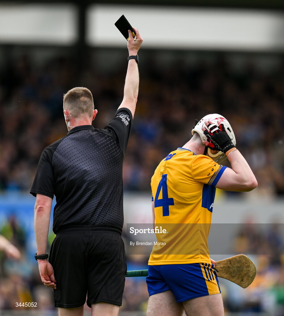 3 May 2026; Adam Hogan of Clare is shown a b;lack card by referee Michael Kennedy during the Munster GAA Senior Hurling Championship Round 3 match between Clare and Limerick at Zimmer Biomet Páirc Chíosóg in Ennis, Clare. Photo by Brendan Moran/Sportsfile