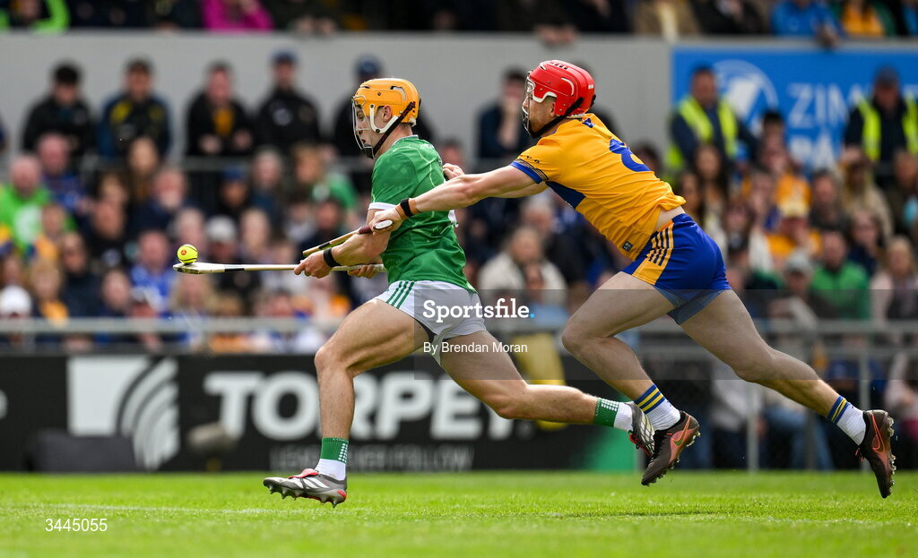 3 May 2026; Adam English of Limerick is tackled by Darragh Lohan of Clare during the Munster GAA Senior Hurling Championship Round 3 match between Clare and Limerick at Zimmer Biomet Páirc Chíosóg in Ennis, Clare. Photo by Brendan Moran/Sportsfile