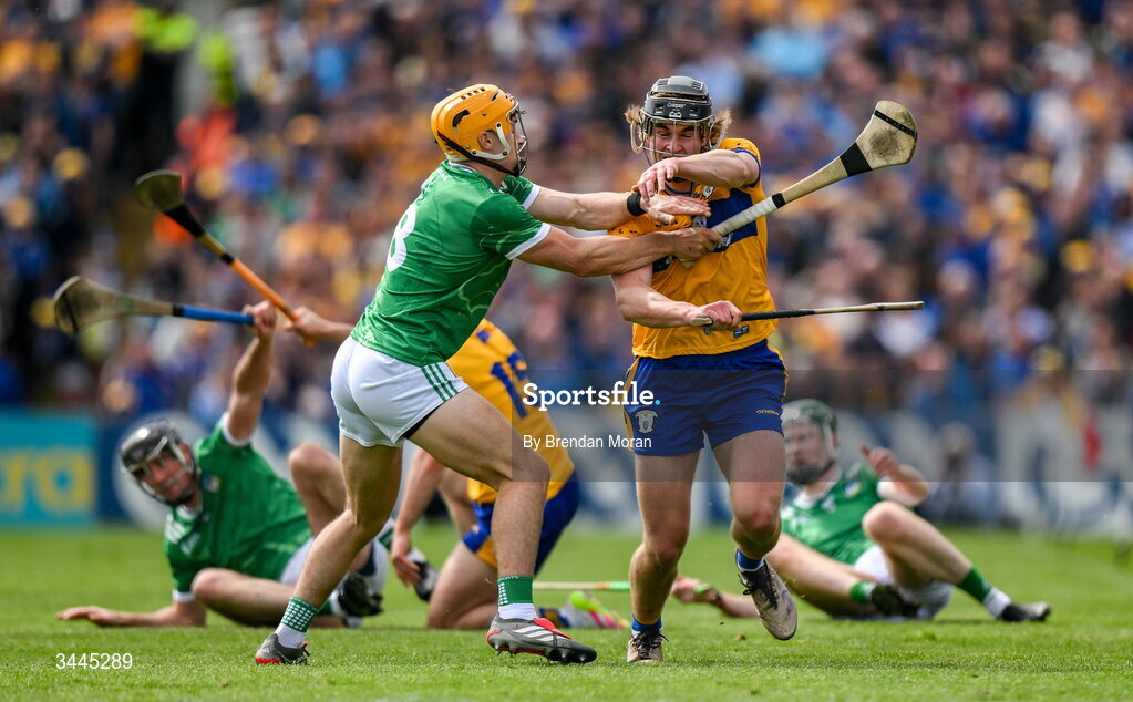 3 May 2026; Diarmuid Stritch of Clare is tackled by Adam English of Limerick, resulting in a second yellow card, and subsequently a red card for Adam English, during the Munster GAA Senior Hurling Championship Round 3 match between Clare and Limerick at Zimmer Biomet Páirc Chíosóg in Ennis, Clare. Photo by Brendan Moran/Sportsfile