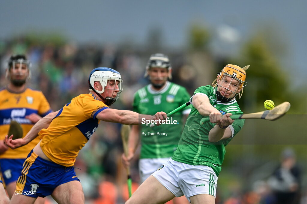 3 May 2026; Fintan Fitzgerald of Limerick scores a point despite the attention of Diarmuid Ryan of Clare during the Munster GAA Senior Hurling Championship Round 3 match between Clare and Limerick at Zimmer Biomet Páirc Chíosóg in Ennis, Clare. Photo by Tom Beary/Sportsfile