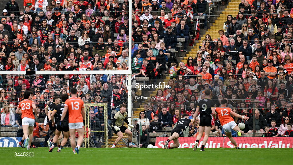 3 May 2026; Tomas McCormack of Armagh shoots to score his side's first goal past Down goalkeeper Ronan Burns during the Ulster GAA Football Senior Championship semi-final match between Armagh and Down at St Tiernach's Park in Clones, Monaghan. Photo by Ramsey Cardy/Sportsfile