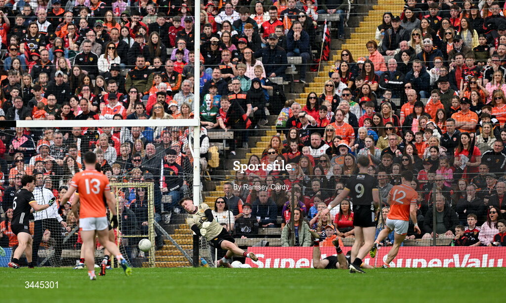 3 May 2026; Tomas McCormack of Armagh shoots to score his side's first goal past Down goalkeeper Ronan Burns during the Ulster GAA Football Senior Championship semi-final match between Armagh and Down at St Tiernach's Park in Clones, Monaghan. Photo by Ramsey Cardy/Sportsfile