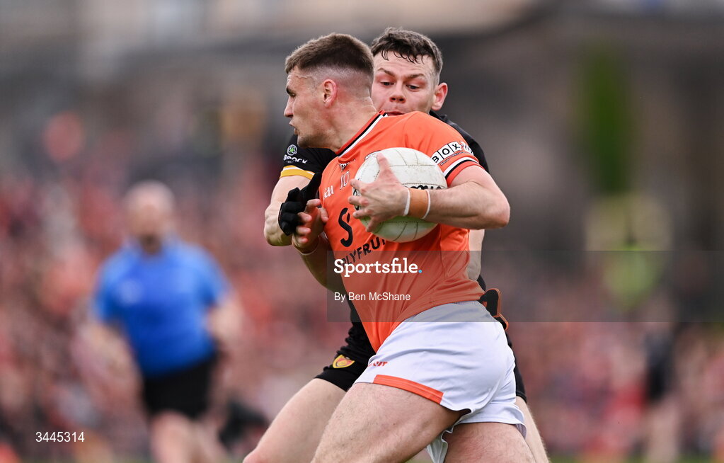 3 May 2026; Greg McCabe of Armagh is tackled by Pearse McPolin of Down during the Ulster GAA Football Senior Championship semi-final match between Armagh and Down at St Tiernach's Park in Clones, Monaghan. Photo by Ben McShane/Sportsfile