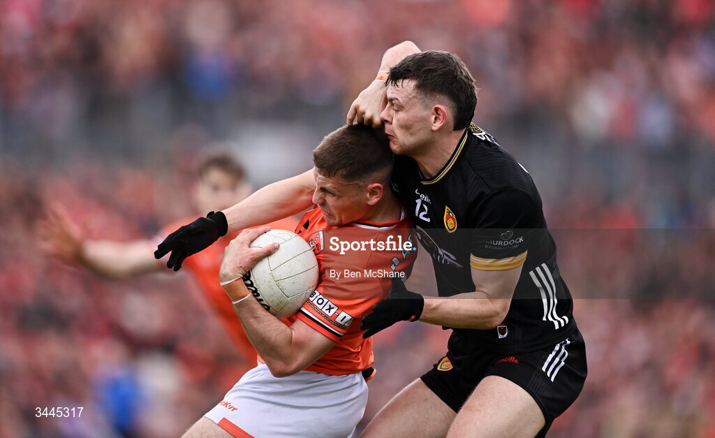 3 May 2026; Greg McCabe of Armagh is tackled by Pearse McPolin of Down during the Ulster GAA Football Senior Championship semi-final match between Armagh and Down at St Tiernach's Park in Clones, Monaghan. Photo by Ben McShane/Sportsfile