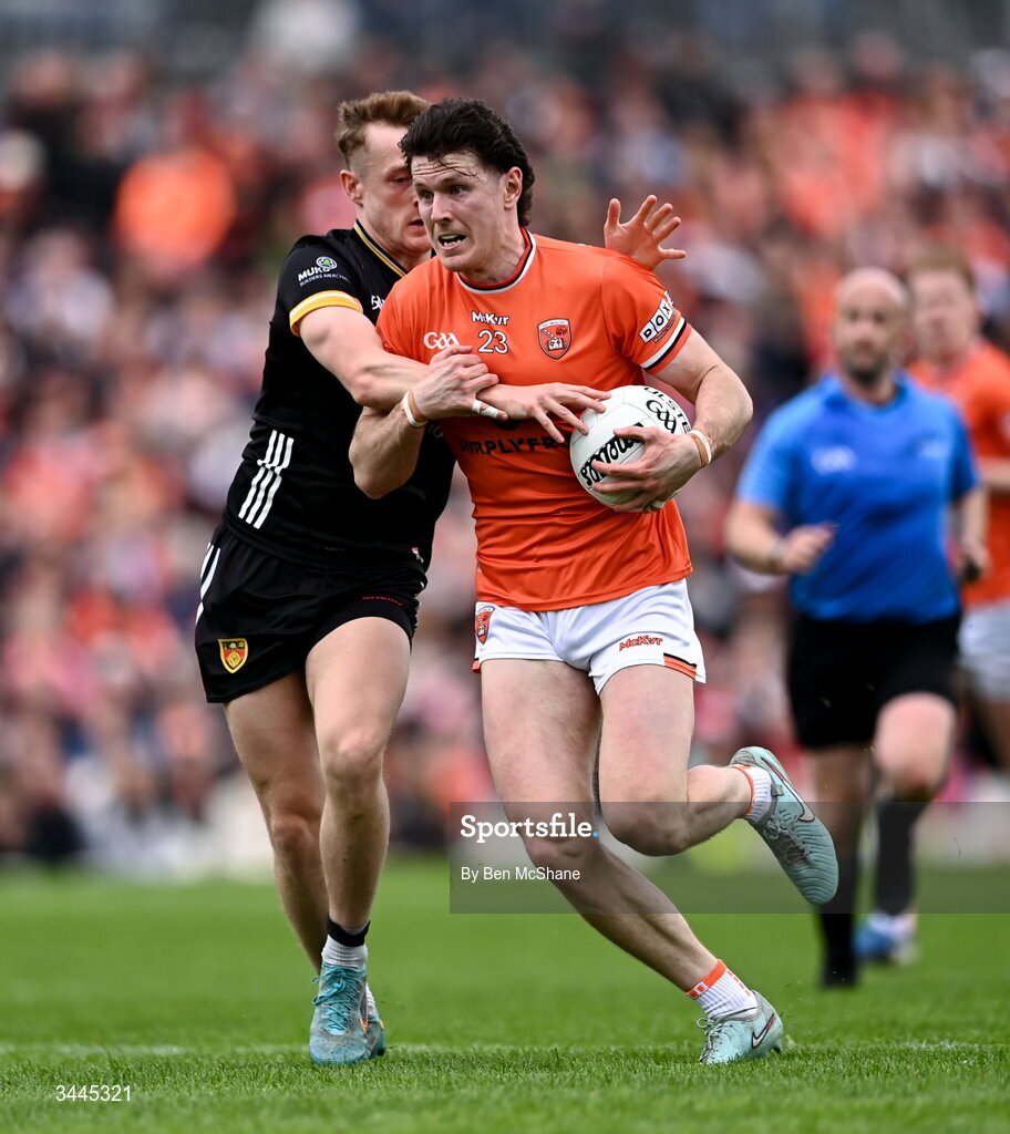3 May 2026; Joe McElroy of Armagh is tackled by Liam Kerr of Down during the Ulster GAA Football Senior Championship semi-final match between Armagh and Down at St Tiernach's Park in Clones, Monaghan. Photo by Ben McShane/Sportsfile