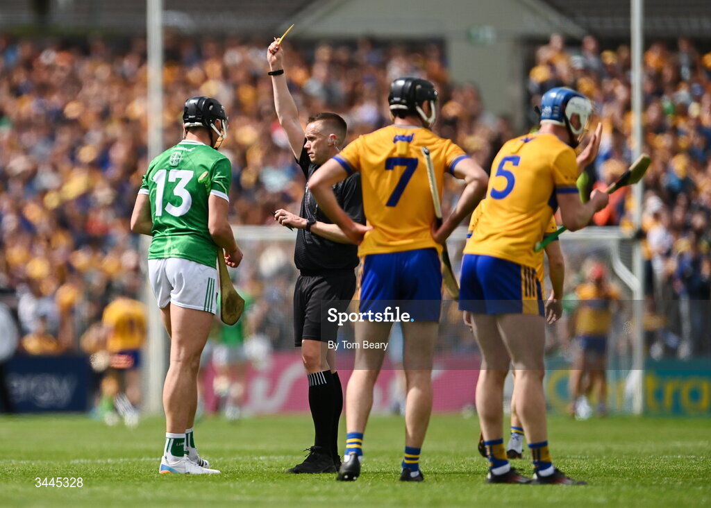 3 May 2026; Referee Michael Kennedy shows a yellow card to Gearóid Hegarty of Limerick  during the Munster GAA Senior Hurling Championship Round 3 match between Clare and Limerick at Zimmer Biomet Páirc Chíosóg in Ennis, Clare. Photo by Tom Beary/Sportsfile