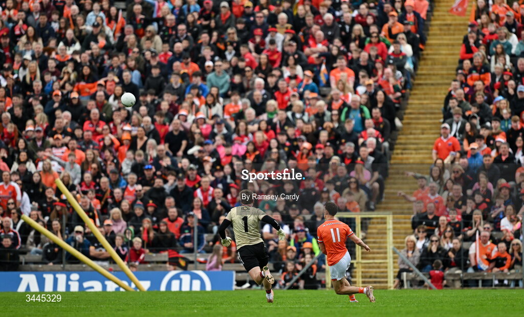 3 May 2026; Darragh McMullan of Armagh scores his side's second goal despite the attention of Down goalkeeper Ronan Burns during the Ulster GAA Football Senior Championship semi-final match between Armagh and Down at St Tiernach's Park in Clones, Monaghan. Photo by Ramsey Cardy/Sportsfile