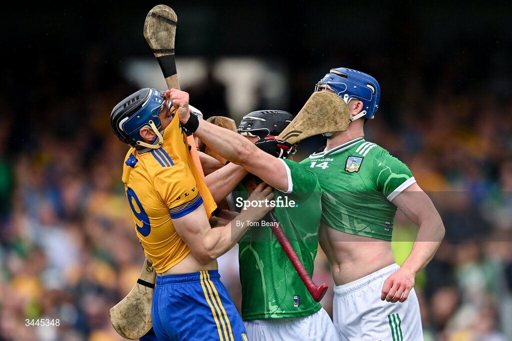 3 May 2026; Aidan O'Connor, left and Shane O'Brien of Limerick tussle with David McInerney, 19, and Adam Hogan of Clare during the Munster GAA Senior Hurling Championship Round 3 match between Clare and Limerick at Zimmer Biomet Páirc Chíosóg in Ennis, Clare. Photo by Tom Beary/Sportsfile