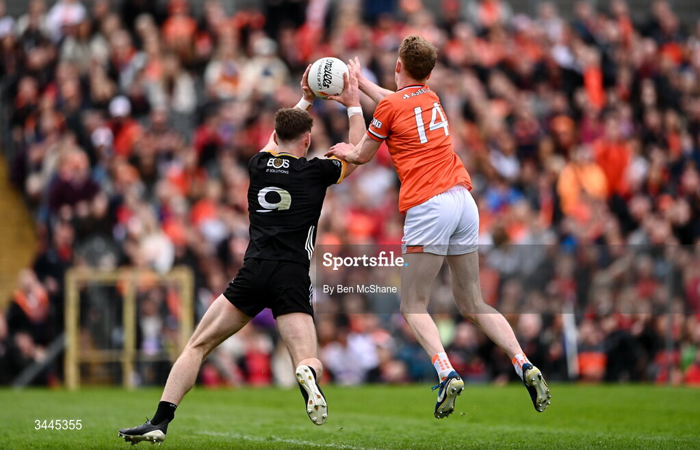 3 May 2026; Conor Turbitt of Armagh scores his side's second goal, despite the tackle of Ryan McEvoy of Down, during the Ulster GAA Football Senior Championship semi-final match between Armagh and Down at St Tiernach's Park in Clones, Monaghan. Photo by Ben McShane/Sportsfile