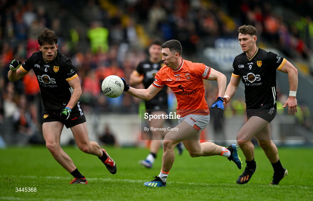 3 May 2026; Oisin Conaty of Armagh in action against Shane Annett, left, and Ryan McEvoy of Down during the Ulster GAA Football Senior Championship semi-final match between Armagh and Down at St Tiernach's Park in Clones, Monaghan. Photo by Ramsey Cardy/Sportsfile