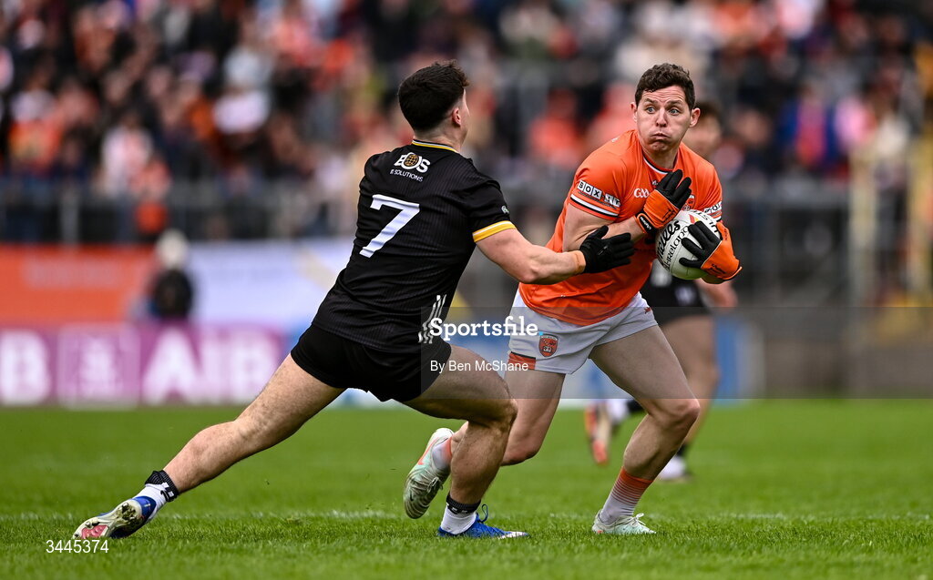 3 May 2026; Paddy Burns of Armagh is tackled by Daniel Guinness of Down during the Ulster GAA Football Senior Championship semi-final match between Armagh and Down at St Tiernach's Park in Clones, Monaghan. Photo by Ben McShane/Sportsfile