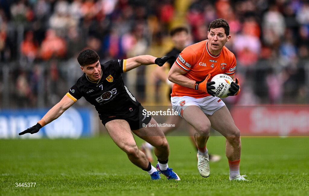 3 May 2026; Paddy Burns of Armagh is tackled by Daniel Guinness of Down during the Ulster GAA Football Senior Championship semi-final match between Armagh and Down at St Tiernach's Park in Clones, Monaghan. Photo by Ben McShane/Sportsfile