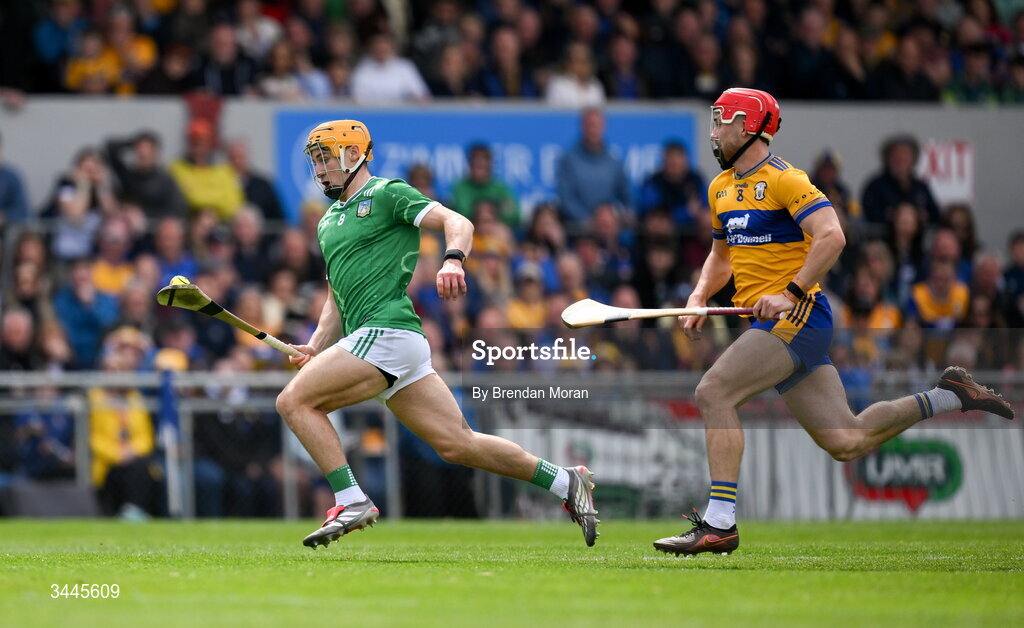 3 May 2026; Adam English of Limerick races clear of Darragh Lohan of Clare during the Munster GAA Senior Hurling Championship Round 3 match between Clare and Limerick at Zimmer Biomet Páirc Chíosóg in Ennis, Clare. Photo by Brendan Moran/Sportsfile