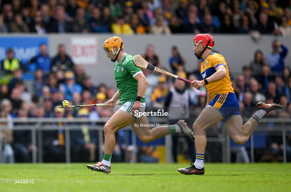 3 May 2026; Adam English of Limerick races clear of Darragh Lohan of Clare during the Munster GAA Senior Hurling Championship Round 3 match between Clare and Limerick at Zimmer Biomet Páirc Chíosóg in Ennis, Clare. Photo by Brendan Moran/Sportsfile