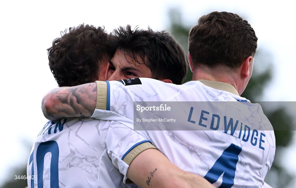 4 May 2026; Shelbourne's John Martin, left, is congratulated by team-mates Rodrigo Freitas and Kameron Ledwidge, right, after scoring his side's first goal during the SSE Airtricity Men's Premier Division match between Bohemians and Shelbourne at Dalymount Park in Dublin. Photo by Stephen McCarthy/Sportsfile