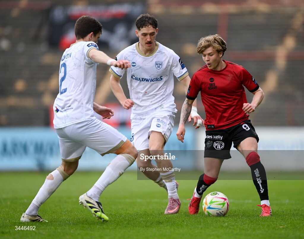 4 May 2026; Harry Vaughan of Bohemians in action against John Martin and Sean Gannon, left, of Shelbourne during the SSE Airtricity Men's Premier Division match between Bohemians and Shelbourne at Dalymount Park in Dublin. Photo by Stephen McCarthy/Sportsfile