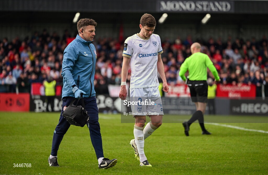 4 May 2026; Sean Gannon of Shelbourne and physiotherapist Mark Cornish during the SSE Airtricity Men's Premier Division match between Bohemians and Shelbourne at Dalymount Park in Dublin. Photo by Stephen McCarthy/Sportsfile
