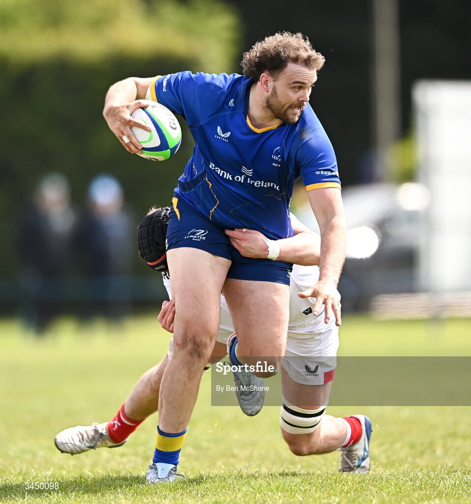 9 May 2026; Kyle Dixon of Leinster is tackled by Michael Rooney of Ulster during the IRFU Men's Junior Interprovincial Round 3 match between Ulster and Leinster at Lisburn RFC in Lisburn, Antrim. Photo by Ben McShane/Sportsfile
