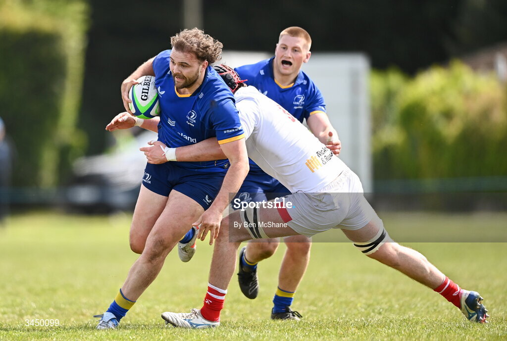 9 May 2026; Kyle Dixon of Leinster is tackled by Michael Rooney of Ulster during the IRFU Men's Junior Interprovincial Round 3 match between Ulster and Leinster at Lisburn RFC in Lisburn, Antrim. Photo by Ben McShane/Sportsfile