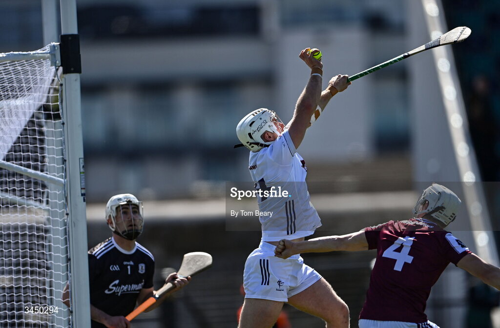 9 May 2026;  Muiris Curtin of Kildare claims a high ball on his way to scoring his side's first goal despite the attention of Galway goalkeeper Darach Fahy, left and Darren Morrissey of Galway during the Leinster GAA Senior Hurling Championship round 3 match between Kildare and Galway at Cedral St Conleth's Park in Newbridge, Kildare. Photo by Tom Beary/Sportsfile