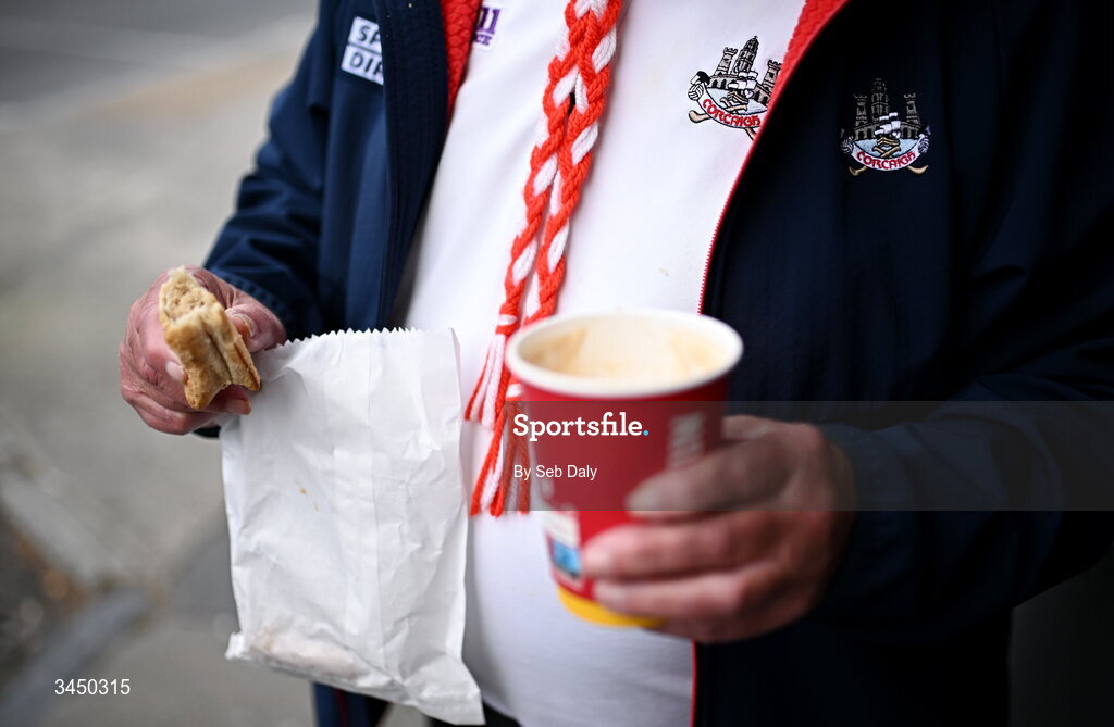 9 May 2026; A Cork supporter enjoys refreshments before the Munster GAA Senior Hurling Championship Round 3 match between Waterford and Cork at Azzurri Walsh Park in Waterford. Photo by Seb Daly/Sportsfile