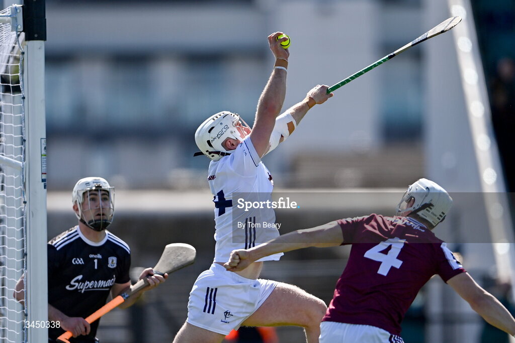 9 May 2026; Muiris Curtin of Kildare claims a high ball on his way to scoring his side's first goal despite the attention of Galway goalkeeper Darach Fahy, left and Darren Morrissey of Galway during the Leinster GAA Senior Hurling Championship round 3 match between Kildare and Galway at Cedral St Conleth's Park in Newbridge, Kildare. Photo by Tom Beary/Sportsfile