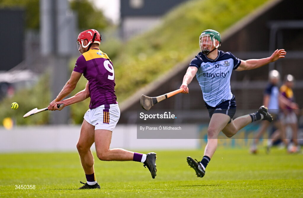 9 May 2026; Conor Hearne of Wexford scores a point as Fergal Whitely of Dublin closes in during the Leinster GAA Senior Hurling Championship round 3 match between Wexford and Dublin at Chadwicks Wexford Park in Wexford. Photo by Piaras Ó Mídheach/Sportsfile