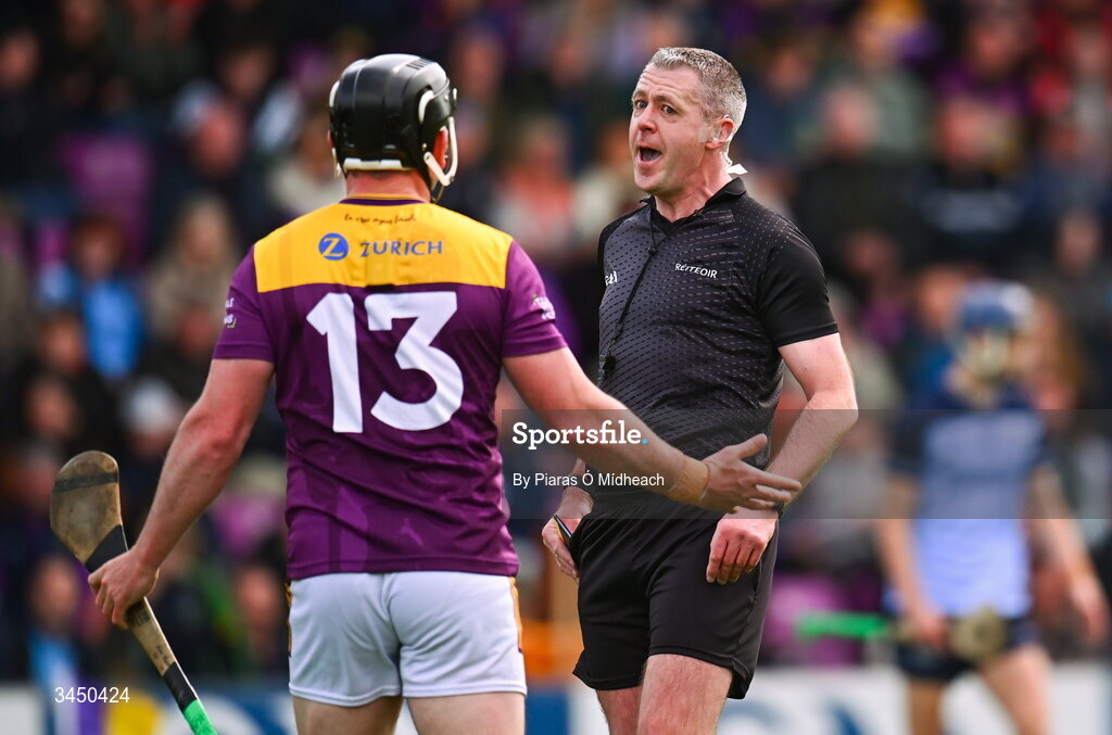 9 May 2026; Referee Shane Hynes with Kevin Foley of Wexford during the Leinster GAA Senior Hurling Championship round 3 match between Wexford and Dublin at Chadwicks Wexford Park in Wexford. Photo by Piaras Ó Mídheach/Sportsfile