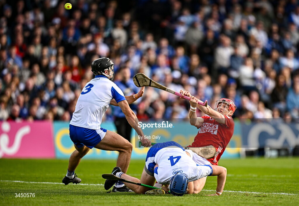 9 May 2026; Alan Connolly of Cork scores a point, under pressure from Waterford players Mark Fitzgerald, left, and Aaron O’Neill, during the Munster GAA Senior Hurling Championship Round 3 match between Waterford and Cork at Azzurri Walsh Park in Waterford. Photo by Seb Daly/Sportsfile