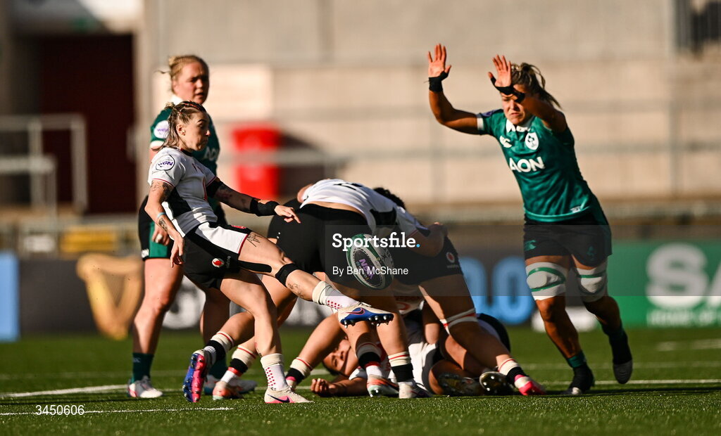 9 May 2026; Keira Bevan of Wales has a kick chased down by Erin King of Ireland during the Women's 6 Nations Rugby Championship match between Ireland and Wales at Affidea Stadium in Belfast. Photo by Ben McShane/Sportsfile