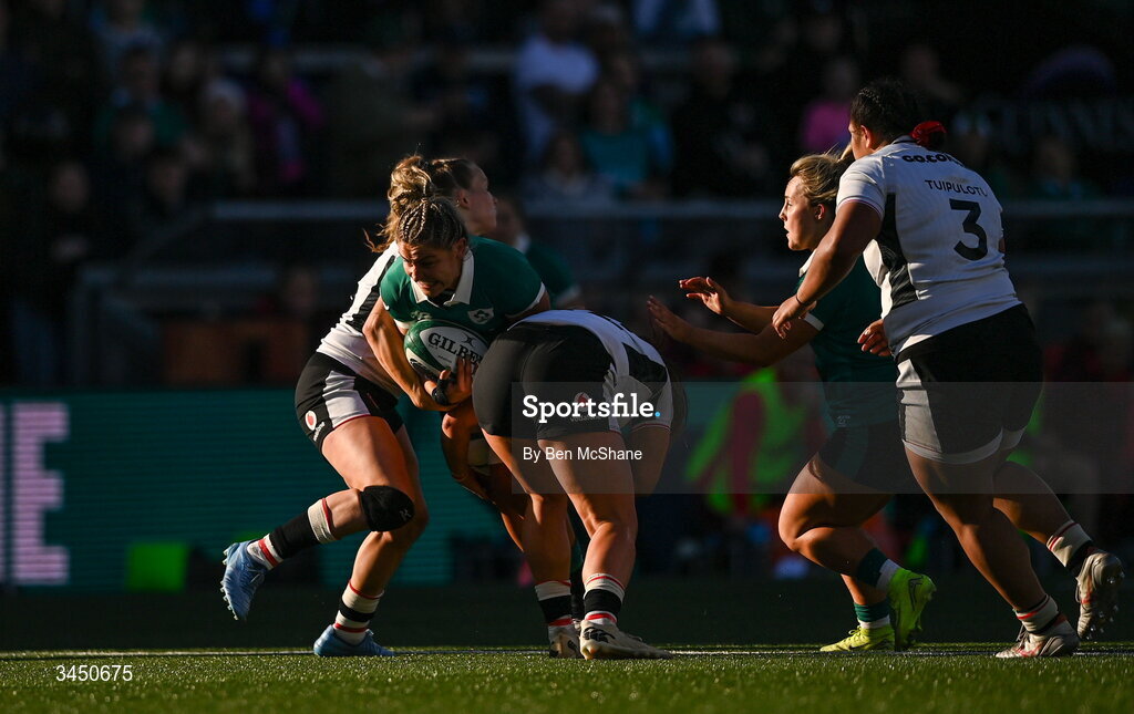 9 May 2026; Clíodhna Moloney MacDonald of Ireland is tackled by Carys Cox, left, and Courtney Keight of Wales during the Women's 6 Nations Rugby Championship match between Ireland and Wales at Affidea Stadium in Belfast. Photo by Ben McShane/Sportsfile