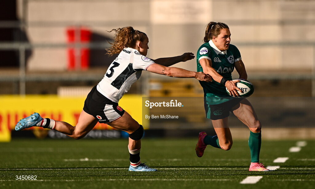 9 May 2026; Béibhinn Parsons of Ireland in action against Carys Cox of Wales during the Women's 6 Nations Rugby Championship match between Ireland and Wales at Affidea Stadium in Belfast. Photo by Ben McShane/Sportsfile