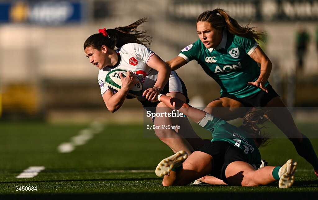 9 May 2026; Kayleigh Powell of Wales is tackled by Robyn O'Connor, bottom, and Béibhinn Parsons of Ireland during the Women's 6 Nations Rugby Championship match between Ireland and Wales at Affidea Stadium in Belfast. Photo by Ben McShane/Sportsfile
