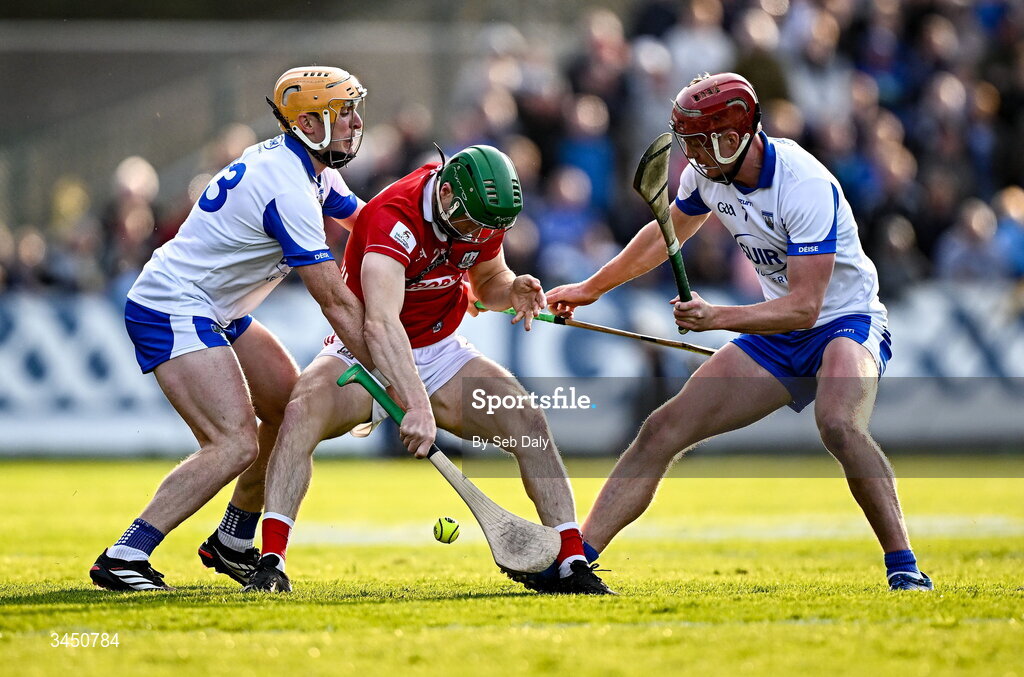9 May 2026; Séamus Harnedy of Cork in action against Waterford players Peter Hogan, left, and Calum Lyons during the Munster GAA Senior Hurling Championship Round 3 match between Waterford and Cork at Azzurri Walsh Park in Waterford. Photo by Seb Daly/Sportsfile